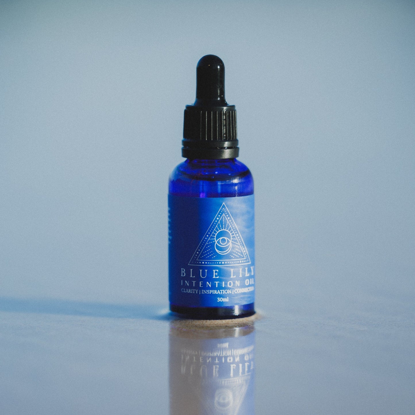 Blue bottle with blue lotus essential oil