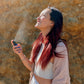 girl spraying clarity mist with blue lotus blue lily essential oil for relaxation