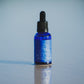 Blue bottle with blue lotus essential oil